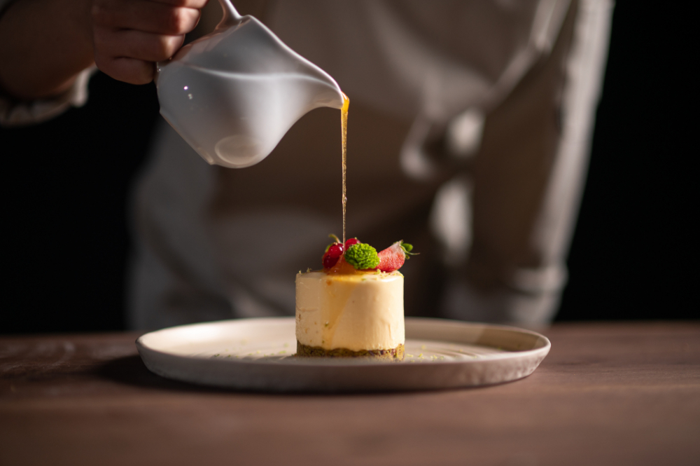 Pouring Sauce on a Fruitcake